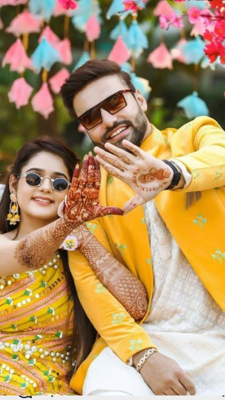 Photo of Bride twirling on haldi in yellow outfit