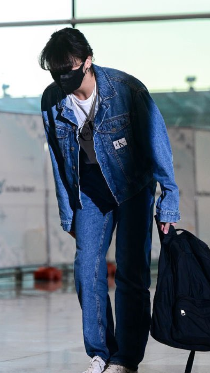 JungKook is all smiles in his latest airport fashion snap, all dressed up  in @calvinklein's '90s straight black denim jacket and jeans 🐰✨ …