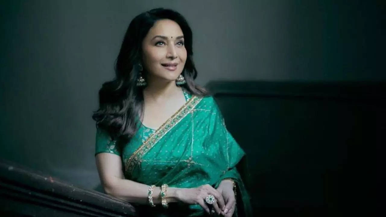 Madhuri Dixit switches on her conventional mode in inexperienced bandhej saree value little lower than a lakh