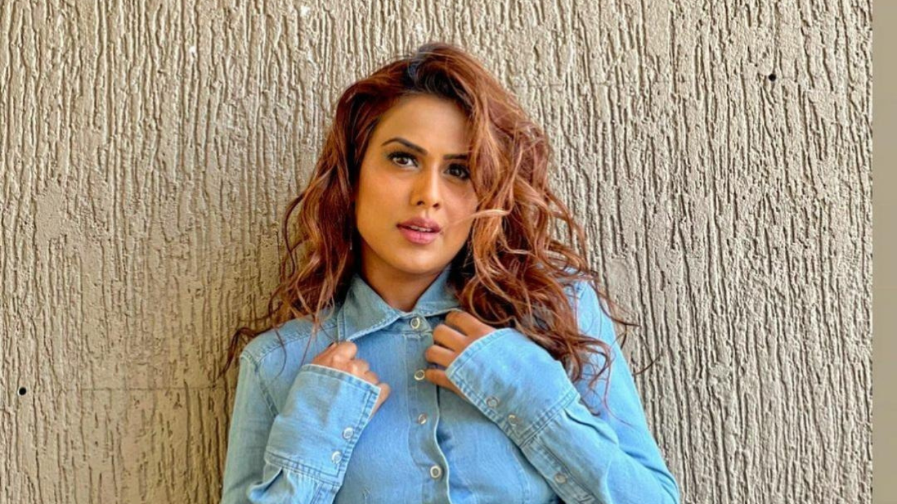 Nia Sharma Poses in Unbuttoned Jeans And Cropped Shirt in Bold