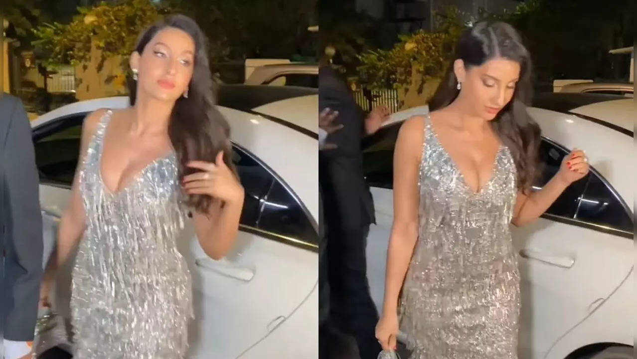 Nora Fatehi escapes an OOPS moment as she almost trips while walking  wearing a bold plunging neckline saree; netizens say 'Girti toh kya hota  socho